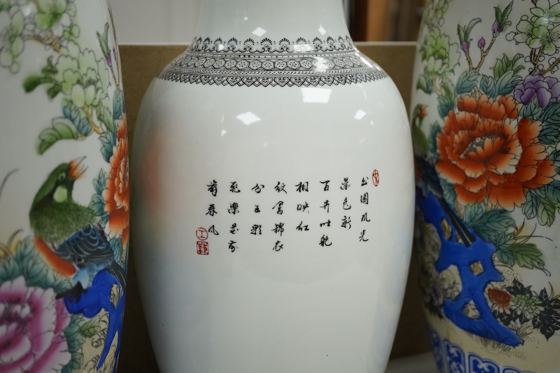 A large pair of Chinese polychrome vases, 60cm high, a pair of famille rose vases, a blue and white brushpot and two other vases (7).